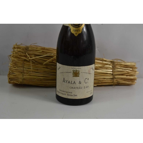 67 - A bottle of Ayala & Co, Chateau d'Ay champagne, 1945 label, with straw packing.