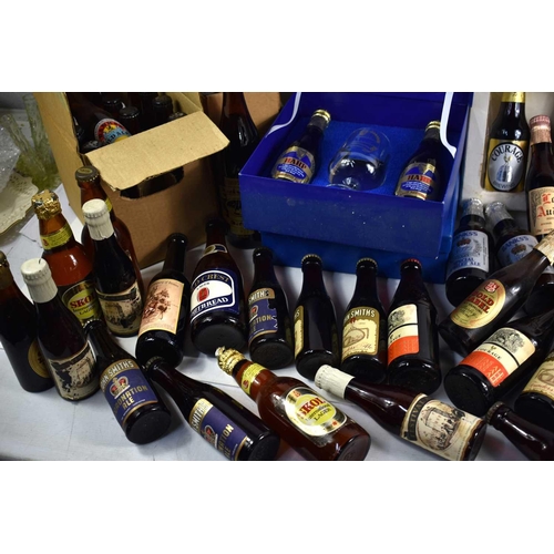 70 - A large collection of vintage commemorative ales and lagers to include Harp lager gift sets commemor... 