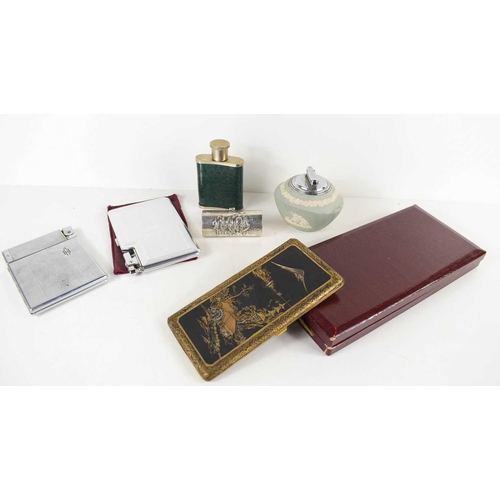 80 - A group of tobacconist ephemera, to include a Japanese cigarette case with matt black ground and dep... 