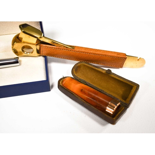 87 - A 9ct gold and amber cigar holder, with the WB Best Make leather case, a Waterman of Paris pen with ... 