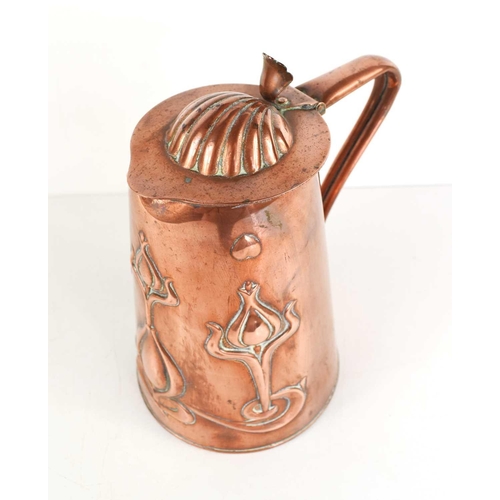 111 - An Arts and Crafts copper jug by Joseph Sankey & Sons, with embossed stylised tulip anbd heart decor... 