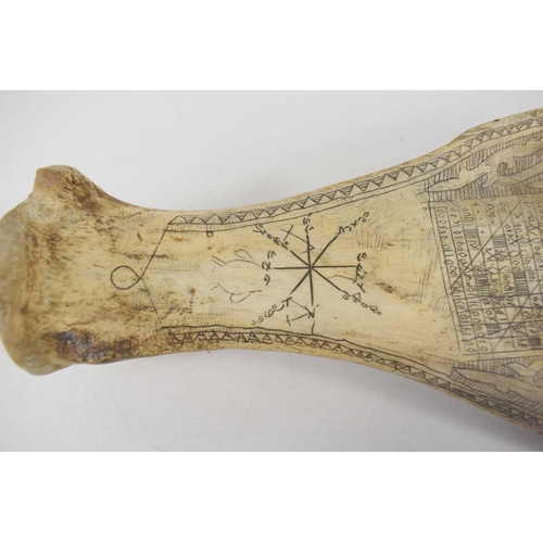 128 - An Indonesian Batak scrimshaw shoulder blade, possibly water buffalo, 30.5cm.