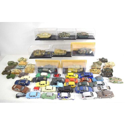 15 - A group of diecast tanks and military vehicles, to incude examples by Corgi, together with a quantit... 