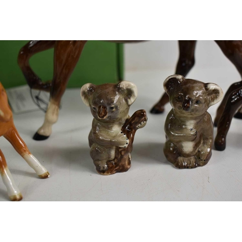 168 - A selection of ceramics to include Beswick foals, horses, duck, mouse, koala bears, and a Royal Doul... 