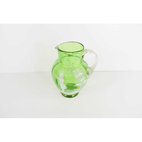 200 - A Victorian green glass Mary Gregory decorated jug, 15cm high.