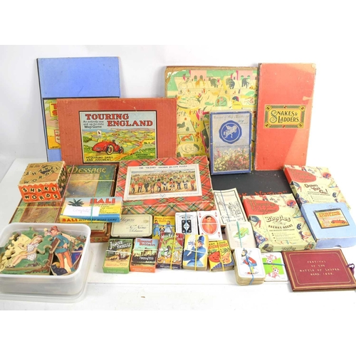 22a - A group of vintage toys to include The Victory Jig Saw puzzle, Touring England Map Game, various car... 