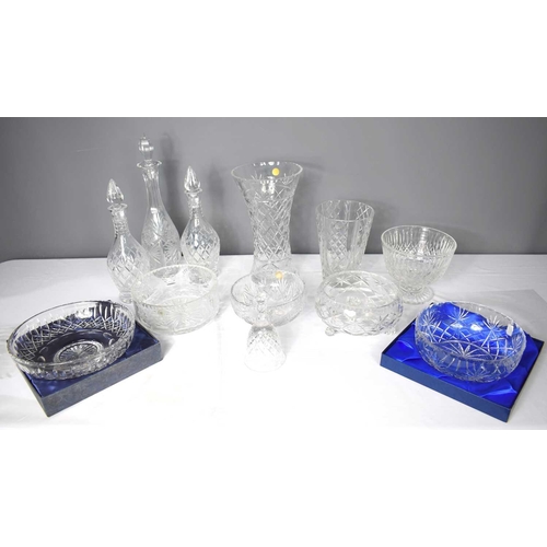 241 - A group of crystal wares to include a pair of Coronet Stuart crystal decanters and bowl in the origi... 