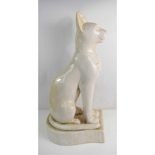 246 - A large ceramic Egyptian Sphynx cat, white glazed and raised on integral plinth, 71cm high.