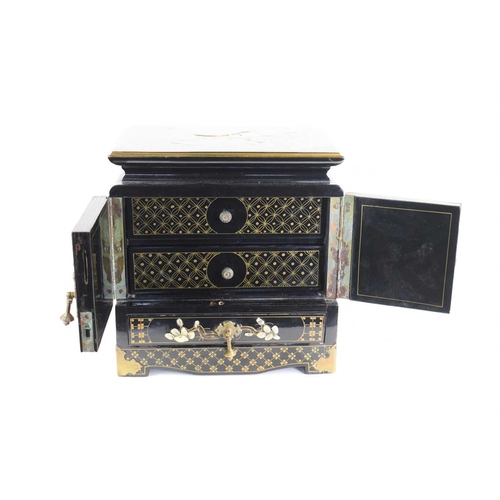 248a - A Chinese black lacquered two door cabinet opening to reveal two drawers with painted and applied de... 