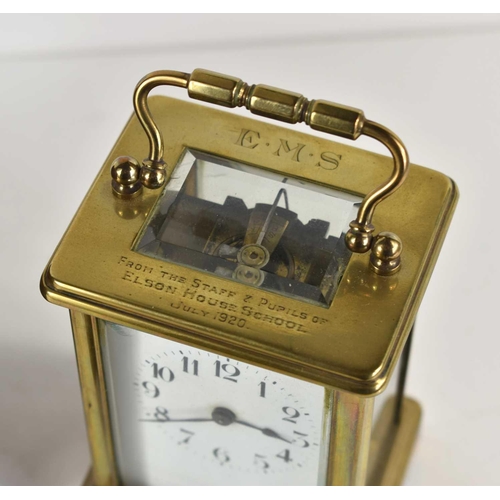 330 - An early 20th century brass cased carriage clock with white enamel Arabic dial, the top engraved 'Fr... 