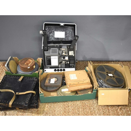 335 - A vintage Bell & Howell Filmosound 16mm cine projector together with a group of 16mm cine film to in... 