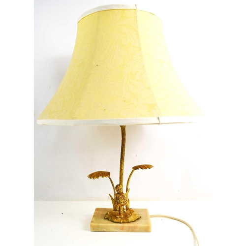 337 - A 20th century gilt metal table lamp, in the form of a boy holding a flower pot, raised on a marble ... 