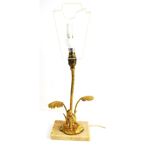 337 - A 20th century gilt metal table lamp, in the form of a boy holding a flower pot, raised on a marble ... 