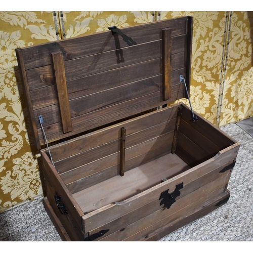 373 - A metal clad wooden chest with twin handles, 92cm by 46cm by 46cm.