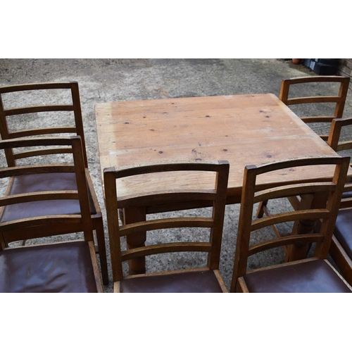 388 - An antique pine kitchen table with single drawer, 75cm by 75cm by 90cm together with a set of six ea... 