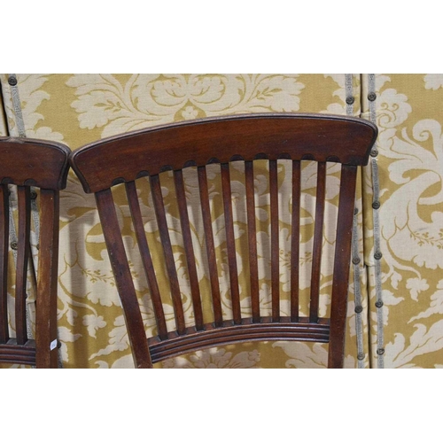 396 - A set of four Edwardian mahogany dining chairs, the curved back rails united by shaped spindles with... 