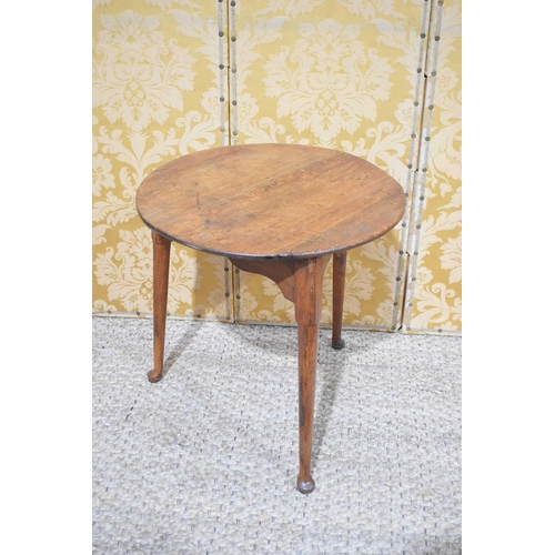 402 - An early 19th century oak cricket table with circular top and triangular from base with tapered legs... 