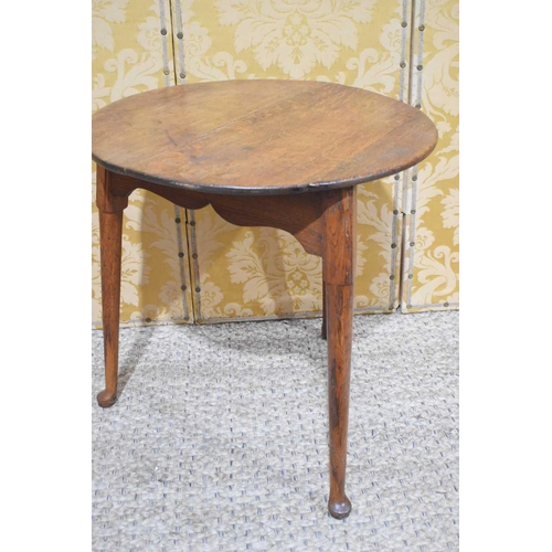 402 - An early 19th century oak cricket table with circular top and triangular from base with tapered legs... 