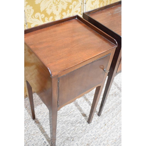 405 - A pair of 19th century mahogany bedside cabinets with single doors, shaped aprons and square tapered... 