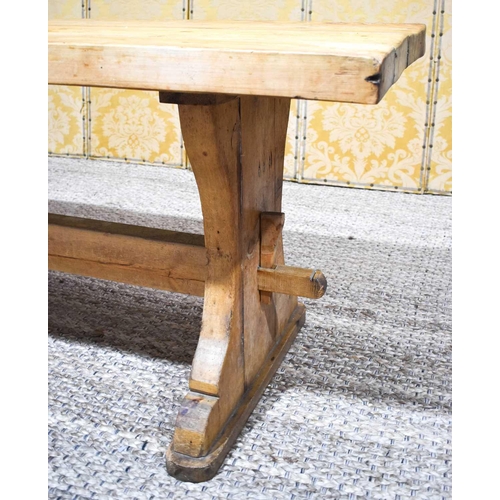 408 - A pine trestle table with thick four plank top, shaped end boards and plain single stretcher, 200 by... 