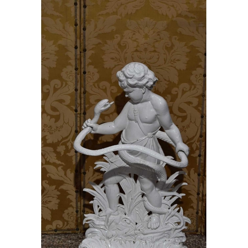 409 - A Victorian cast iron umbrella stand in the form of a cherub wrestling a snake, painted white, 82cm ... 