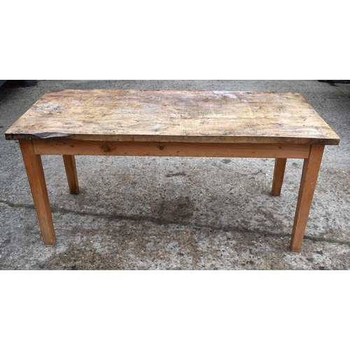 410 - An antique elm top kitchen table raised on square tapered legs, 77cm by 166cm by 74cm