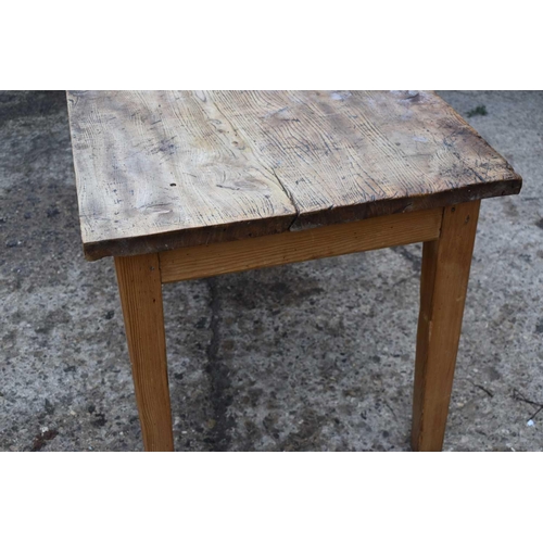 410 - An antique elm top kitchen table raised on square tapered legs, 77cm by 166cm by 74cm