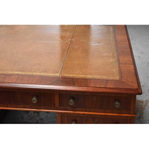 412 - A large 19th century mahogany twin pedestal partners desk with leather top, with nine drawers each s... 