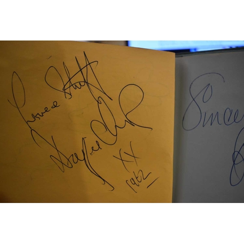 56 - Three autograph books containing the signatures of Adam Faith, Paul McCartney Vic Flick, Billy Burde... 