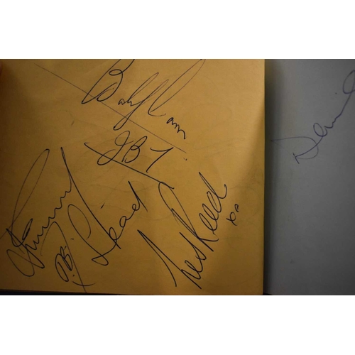 56 - Three autograph books containing the signatures of Adam Faith, Paul McCartney Vic Flick, Billy Burde... 