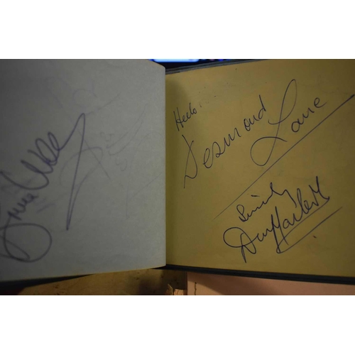 56 - Three autograph books containing the signatures of Adam Faith, Paul McCartney Vic Flick, Billy Burde... 