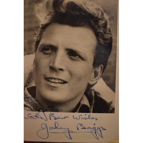 56 - Three autograph books containing the signatures of Adam Faith, Paul McCartney Vic Flick, Billy Burde... 