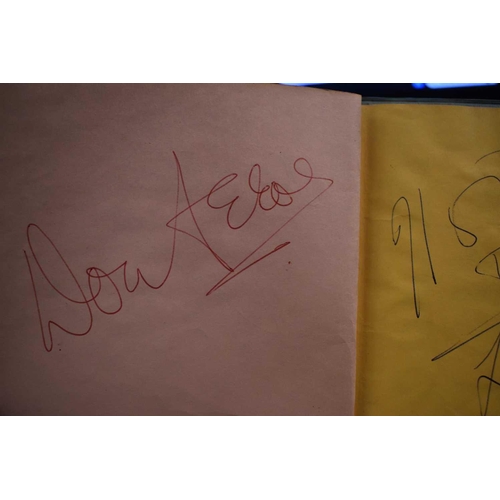 56 - Three autograph books containing the signatures of Adam Faith, Paul McCartney Vic Flick, Billy Burde... 