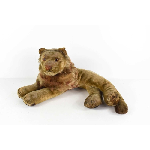 7 - A vintage Steiff lion, in recumbent position, A/F, 30cm long.