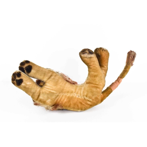 7 - A vintage Steiff lion, in recumbent position, A/F, 30cm long.