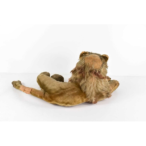 7 - A vintage Steiff lion, in recumbent position, A/F, 30cm long.