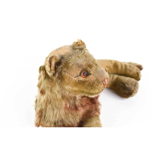 7 - A vintage Steiff lion, in recumbent position, A/F, 30cm long.