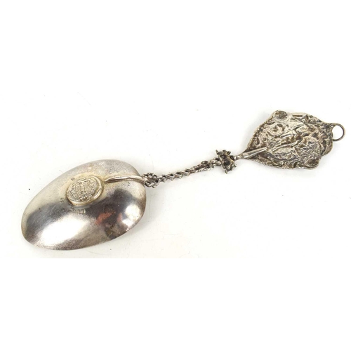 77 - A silver plated replica of a 17th century continental silver spoon, with embossed crest form handle,... 