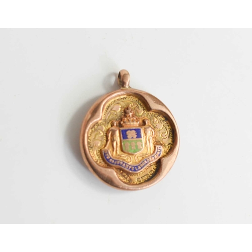 340 - A 9ct gold and enamel medallion, the crest bearing Latin motto, dated 1925-6 and initialled verso, 7... 