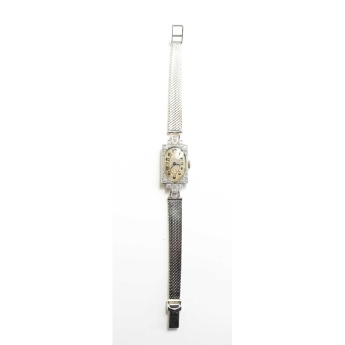 353 - A platinum & 18ct gold, diamond Art Deco cocktail wristwatch, with a 9ct white gold strap, the oval ... 