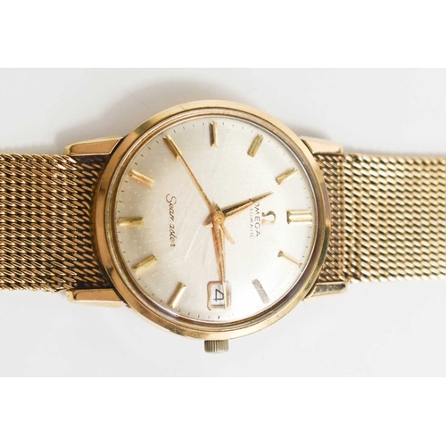 354 - A 9ct gold 1960s Omega Seamaster Automatic wristwatch, with an 9ct gold strap, 68g total weight. The... 