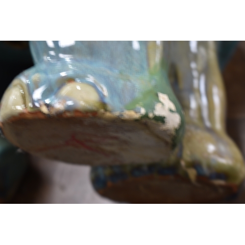 229 - A large 20th century pottery elephant, with a mottled blue and green glaze, together with a selectio... 