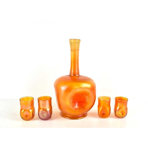 296 - Louis Comfort Tiffany (1848-1933): An iridescent orange Favrile glass decanter and four glasses, the... 