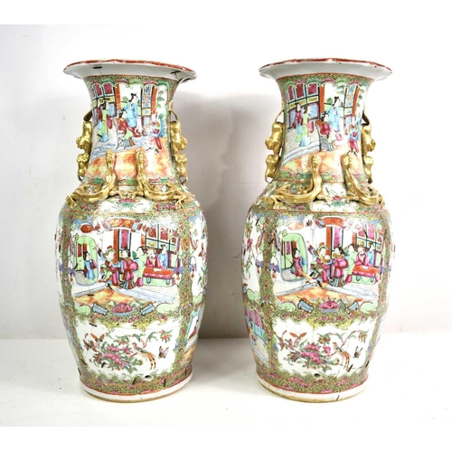 301 - A pair of 19th Century Chinese canton vases, modelled with dogs of faux to the shoulders and salaman... 