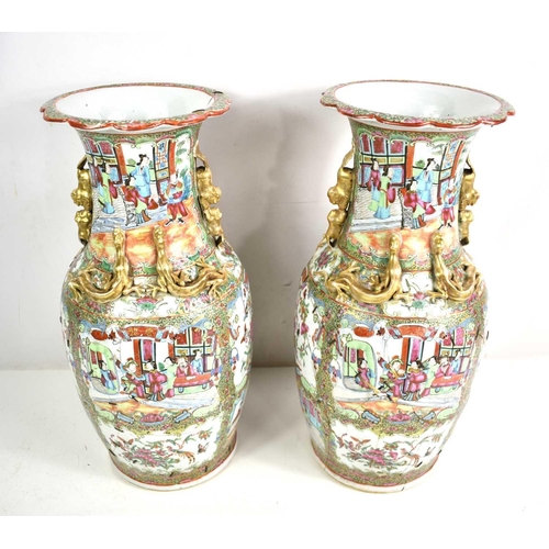 301 - A pair of 19th Century Chinese canton vases, modelled with dogs of faux to the shoulders and salaman... 