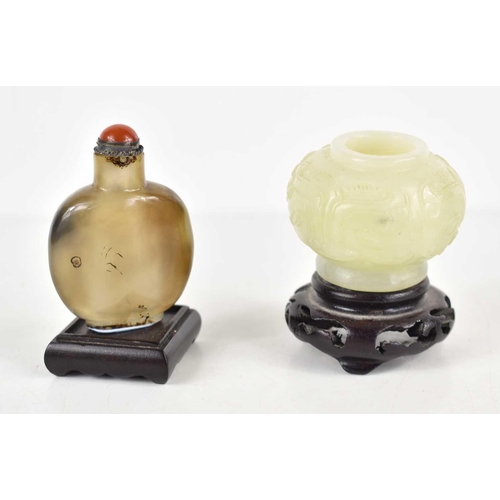 307 - A Chinese jade vase of small proportions, carved with foliage, together with a Chinese agate snuff b... 