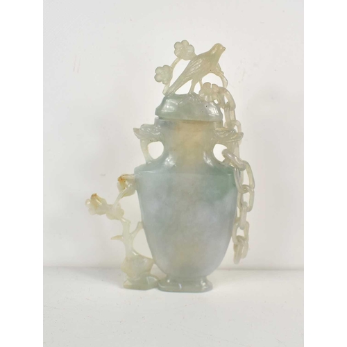 312 - A Chinese carved blue jade vase and cover, the cover attached to the body by a single chain and havi... 