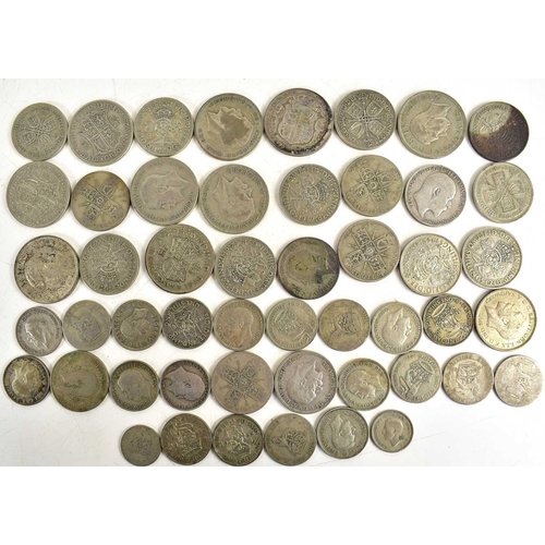 321 - A group of pre 1947 silver coins to include half crowns, shillings and others, 451g.