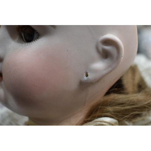 89 - An Etienne Denamur Depose bisque porcelain head bebe companion doll, no. 13, with composition body a... 