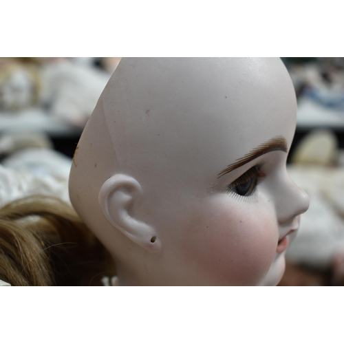 89 - An Etienne Denamur Depose bisque porcelain head bebe companion doll, no. 13, with composition body a... 